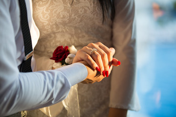 Hands of the woman and man holding each others', couple in love,