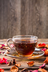 Teacup on table with petals