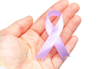 female hands holding AIDS awareness ribbon