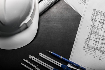 Construction planning drawings on black background