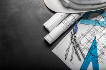 Construction planning drawings on black background