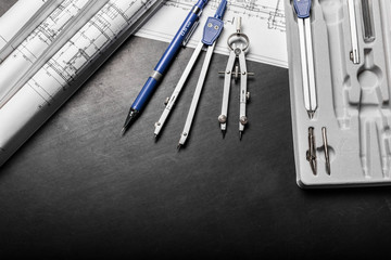 Construction planning drawings on black background