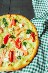 Fresh tasty pizza on wooden background