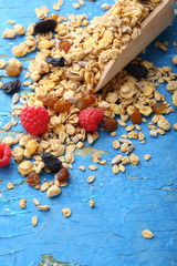 Raw grain breakfast on wood spoon