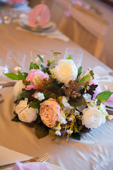 Elegant table setting with beautiful flowers and napkins, vertical