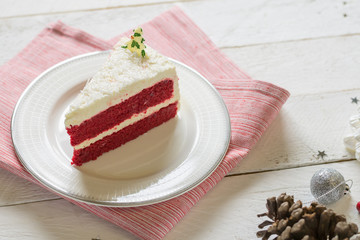 red velvet cake with white cream decoration on white table
