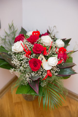 Bouquet of white and red roses for engagement and wedding for bride, vertical