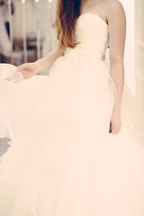 Wedding bridal white dress in the showroom fashion, abstract, vintage verticle