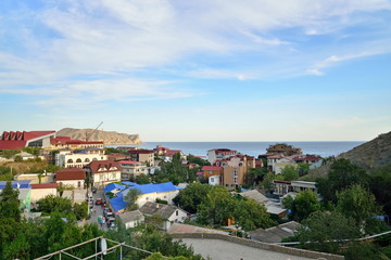 The panorama of the evening city Sudak. Sudak. Crimea