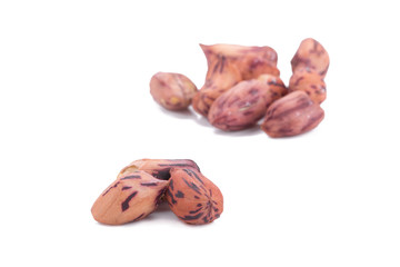 Roasted tiger peanuts on white background.