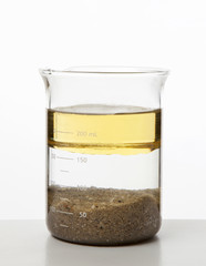 Mixture of water, oil and sand