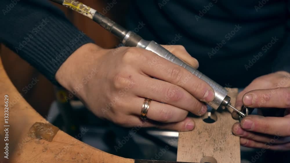 Wall mural Jeweler at work in jewelery workshop