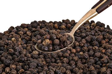 Whole Black Pepper on  Old  Brass Spoon