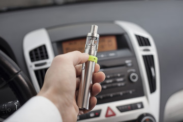 Electronic cigarette at the wheel.
