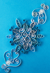 Quilling pattern on a blue background