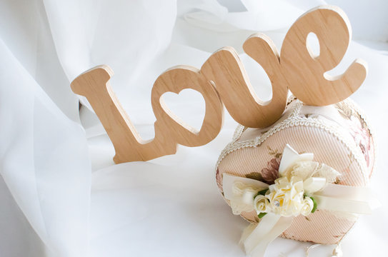 The word love is made of wood and beautiful vintage jewelry box