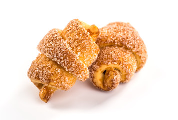 pile of fresh and delicious croissants on a white background