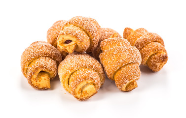 pile of fresh and delicious croissants on a white background