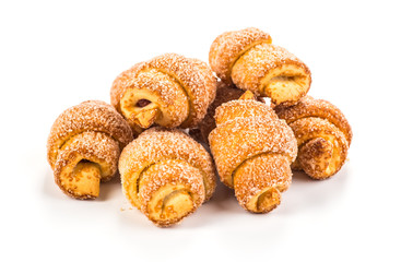 pile of fresh and delicious croissants on a white background
