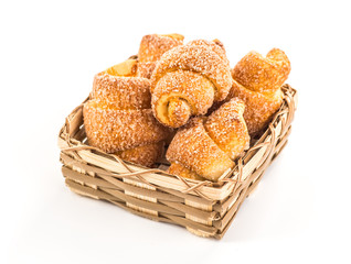pile of fresh and delicious croissants on a white background