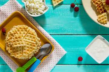 Dinner or lunch for children - cakes and fruit, waffles with cot