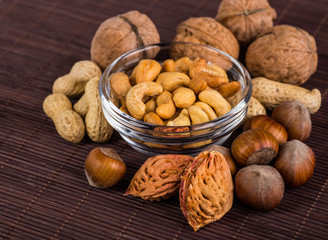 Nuts mix in a wooden plate
