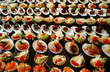Savoury Canapes with Ham and Red Fish Closeup Ctock Photo 