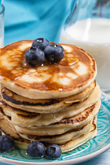 Stack of pancakes with fresh blueberry and honey, healthy breakfast concept, closeup