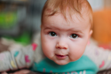 little cute baby toddler on carpet close up smiling adorable happy emotional playing at home