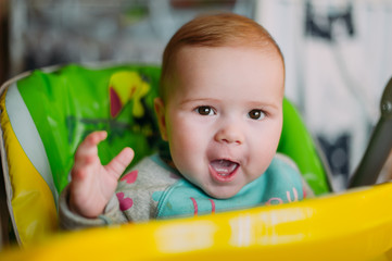 little cute baby toddler on carpet close up smiling adorable happy emotional playing at home