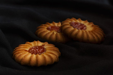 Three cookies with jam in dark and moody