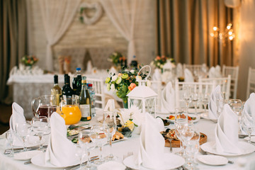 Table setting at a luxury wedding reception. 