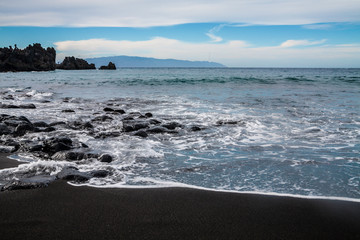 Fototapeta na wymiar Playa la Arena black volcanic sand beach, Tenerife, Canary islands, Spain