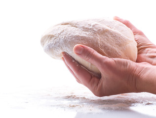raw yeast dough in hands