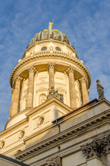 Fototapeta na wymiar View on French Cathedral at Gendarmenmarkt square in golden afternoon light, Berlin, Germany