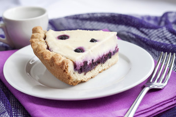 Piece of cheesecake with blueberries