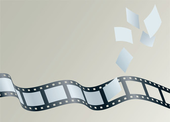 A strip of 35mm film with frames detaching and floating away.