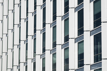 White cold business building with windows pattern