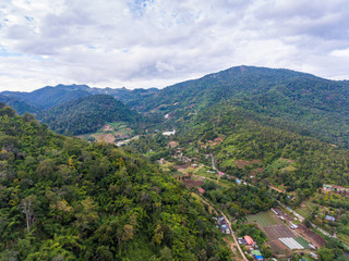Aerial View of Small Village among Mountains.
