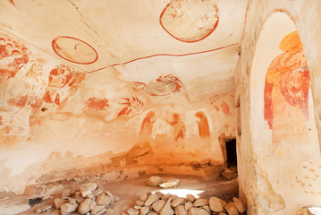 Interior of artistic cave with ancient murals of 6th century David Gareja christian monastery, Georgia