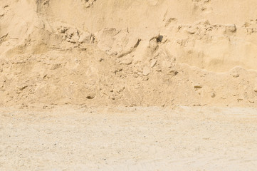 Closeup surface pile of sand for construction work with ground textured background