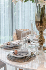 table set on round table dining in luxury dining room