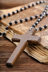 Old holy bible and wooden cross