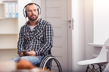 Attractive disabled man dreaming about something