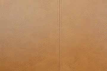 Fototapeta premium Empty gold brown animal skins with sewing line for Tailor crafting business, leather at textile factory 