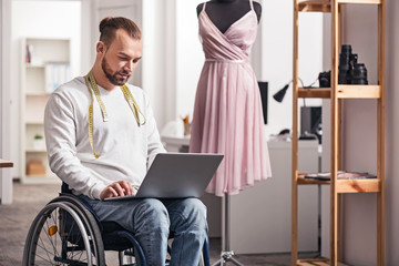 Pleased disabled designer reporting on progress