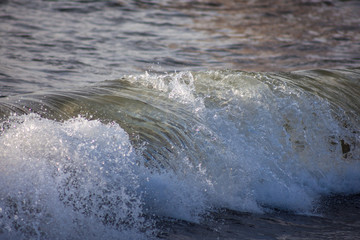 Rare close up detail of wave in the sea near beach