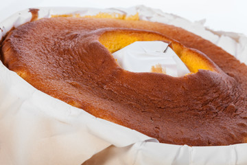 Close up of Pao de Lo, the Portuguese sponge cake shown in its most traditional form, with the...