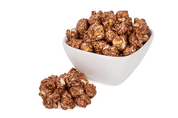 Popcorns flavored with sweet chocolate and mint in a bowl isolated on white background