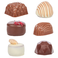 Pack, set or collection of gourmet bonbons, aka bon-bons and truffles made of dark, white and milk chocolate isolated on white background